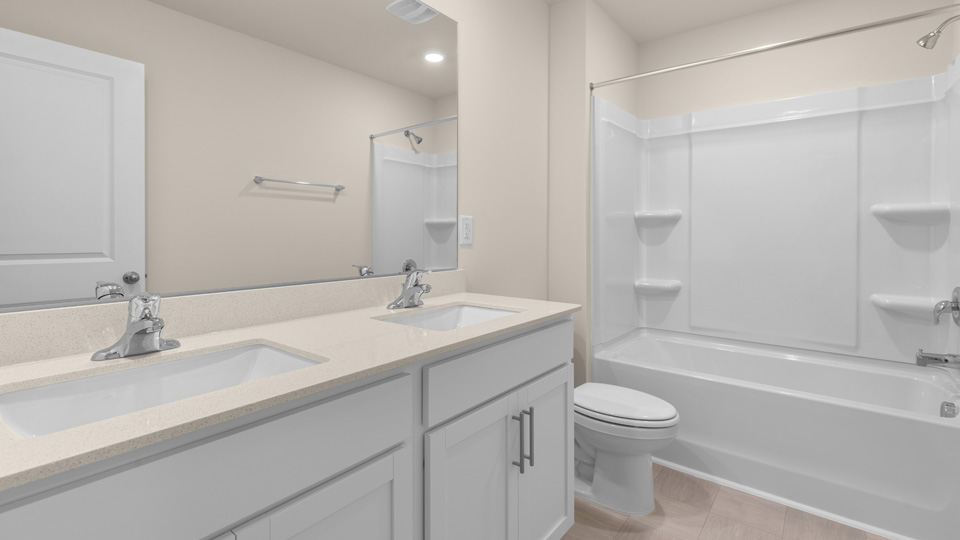 Bathroom with white cabinets