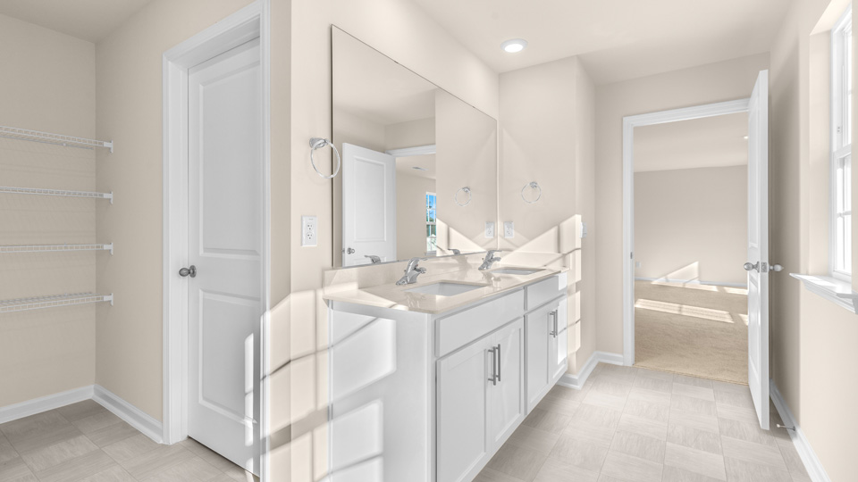 Bathroom with white cabinets