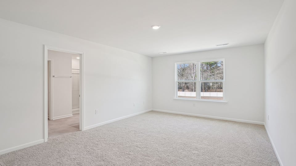 loft with carpet flooring
