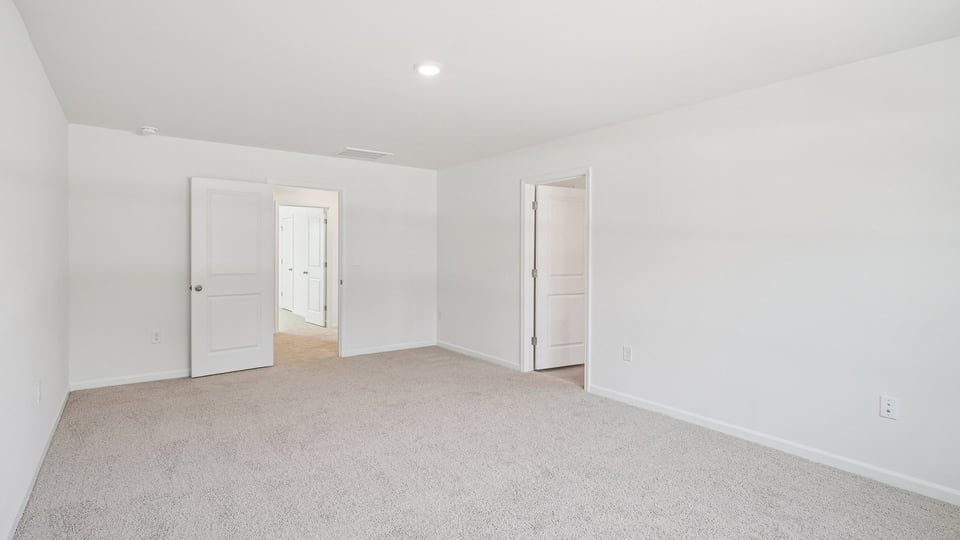 loft with carpet flooring