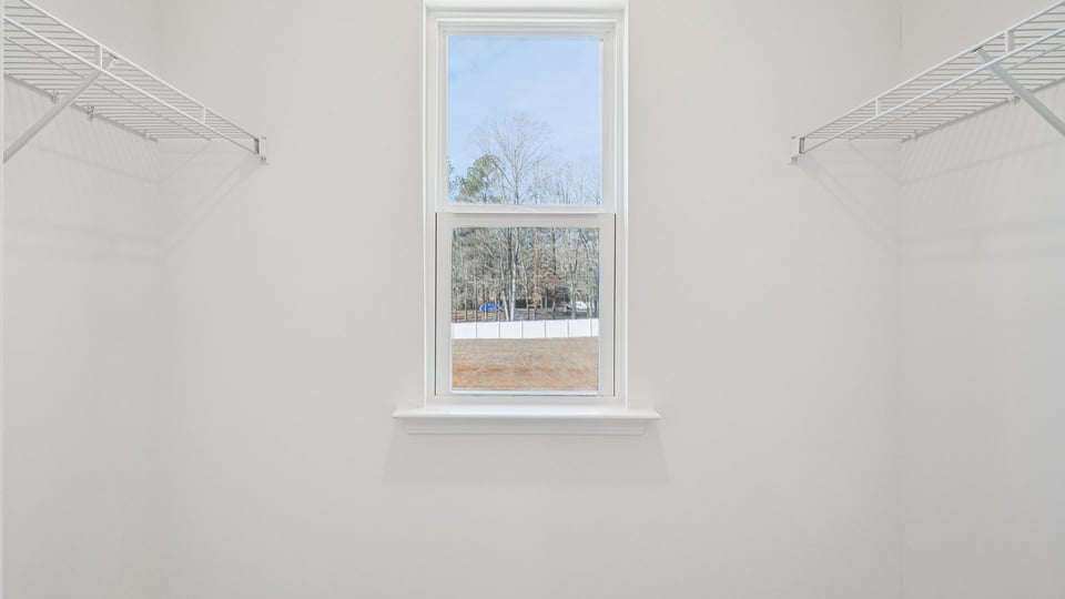 walkin closet with window for natural lighting