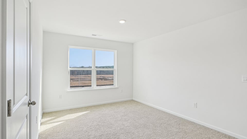 loft with carpet flooring