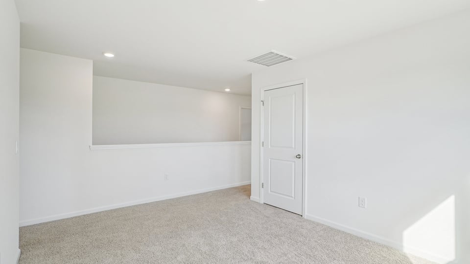 loft with carpet flooring