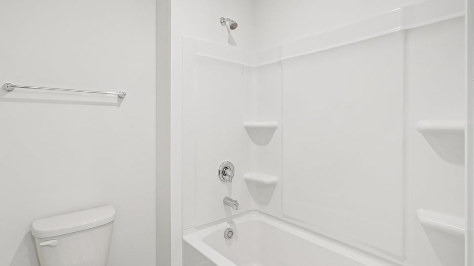 bathroom with tub shower combo and quartz countertops