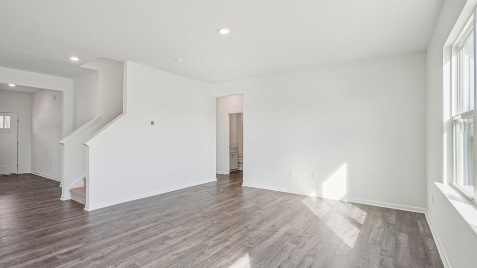 open concept living room with revwood flooring