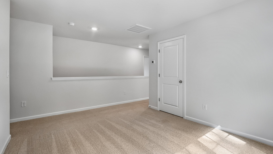 Loft area with carpet