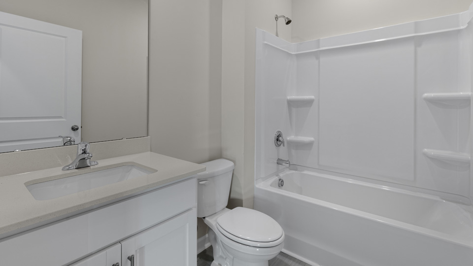 Bathroom with white cabinets