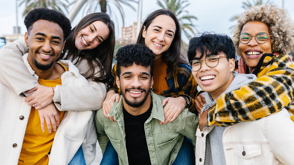 multiracial friends smiling at camera