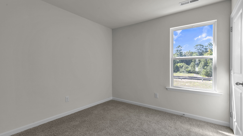 Bedroom with carpet flooring
