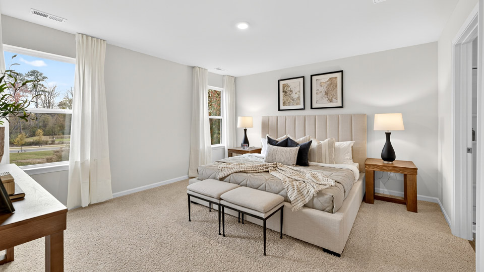 bedroom with natural lighting and carpet flooring