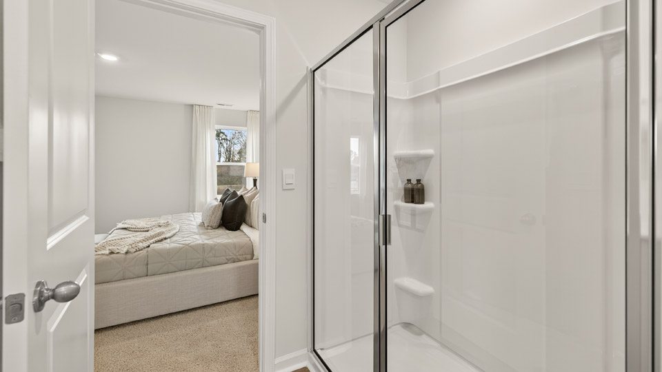 bathroom with walkin shower with glass doors