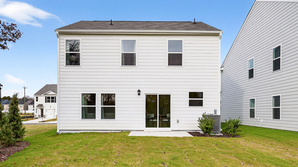 spacious backyard with concrete patio