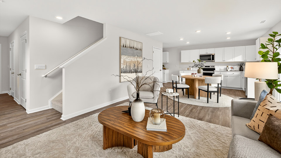 open concept living room overlooked by kitchen