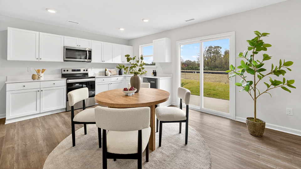 dining area next to kitchen and sliding glass doors to patio