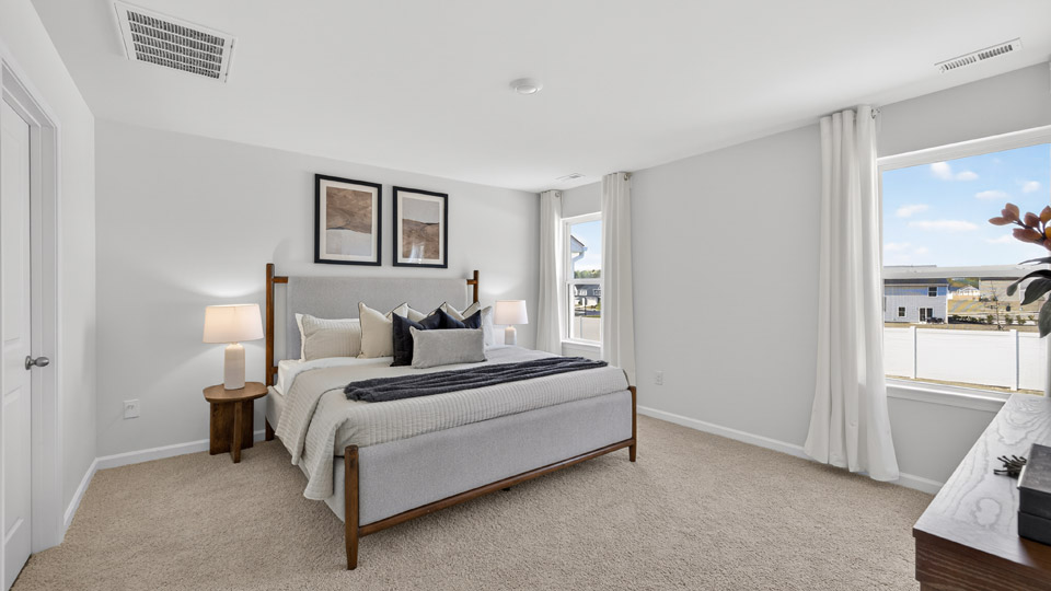 primary bedroom with carpet flooring