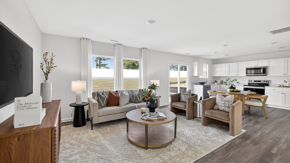 open concept living room overlooked by kitchen