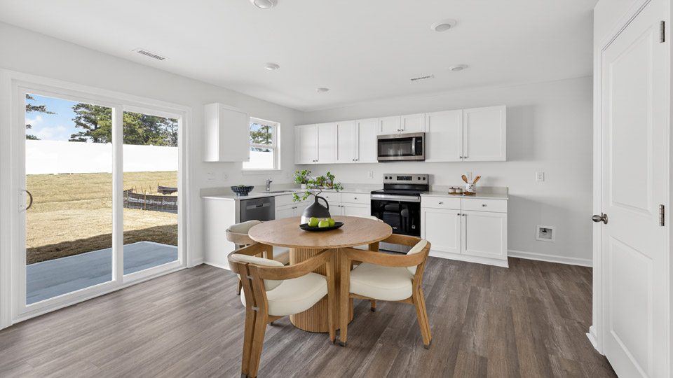 dining area overlooked by kitchen with sliding glass doors