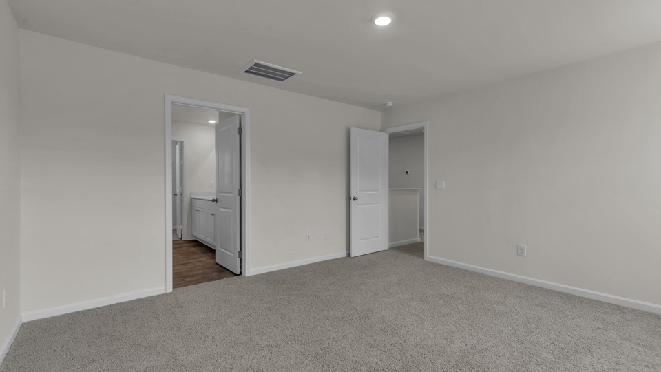 upstairs loft area with large windows and carpeting