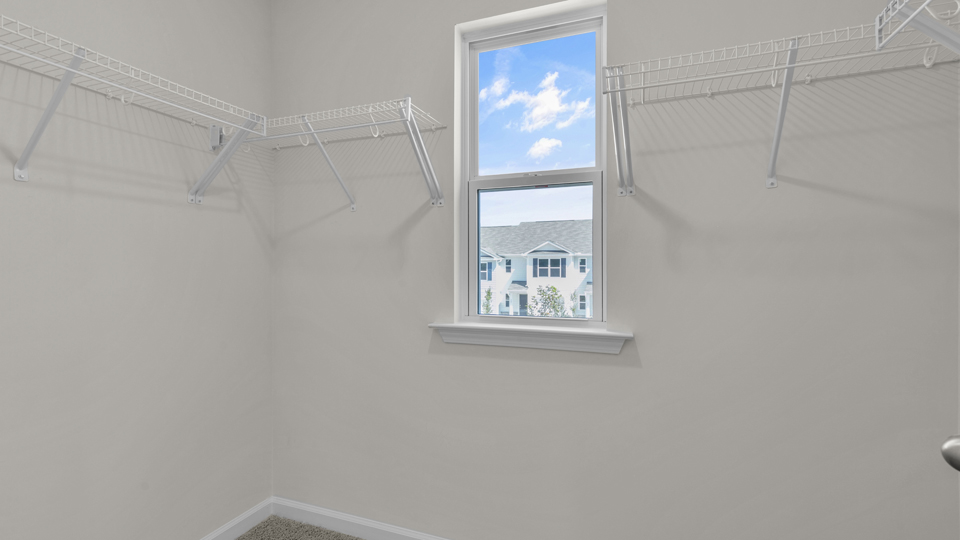 walk in closet with wire shelving