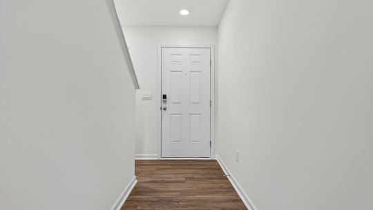 foyer entryway with revwood flooring