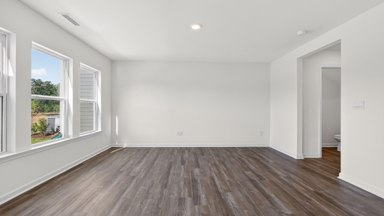 living room with revwood flooring
