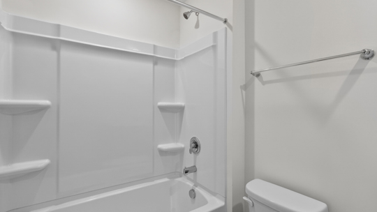 bathroom with tub shower combo