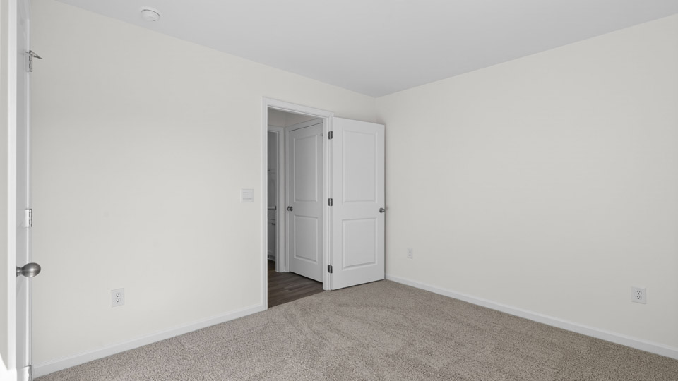 Bedroom with carpet floor and closet
