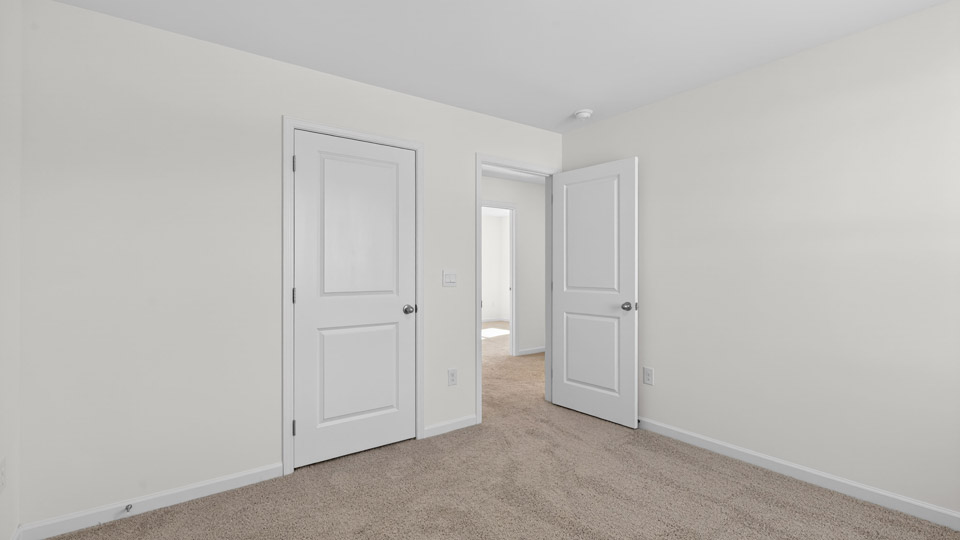 Bedroom with carpet floor and closet