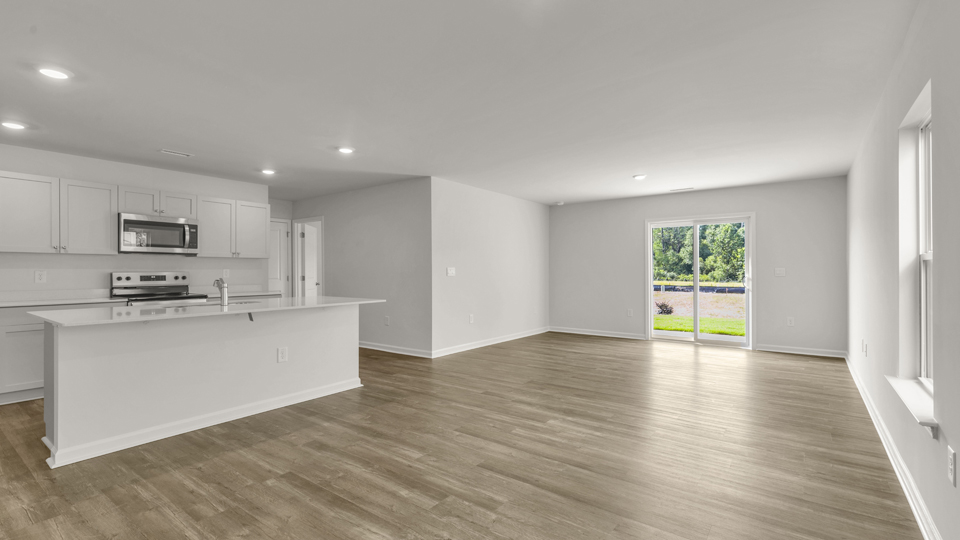 open concept living space with large windows