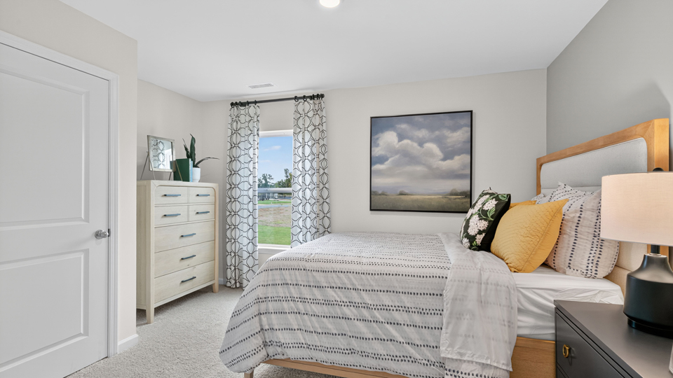 additional bedroom with window, carpeting, closet