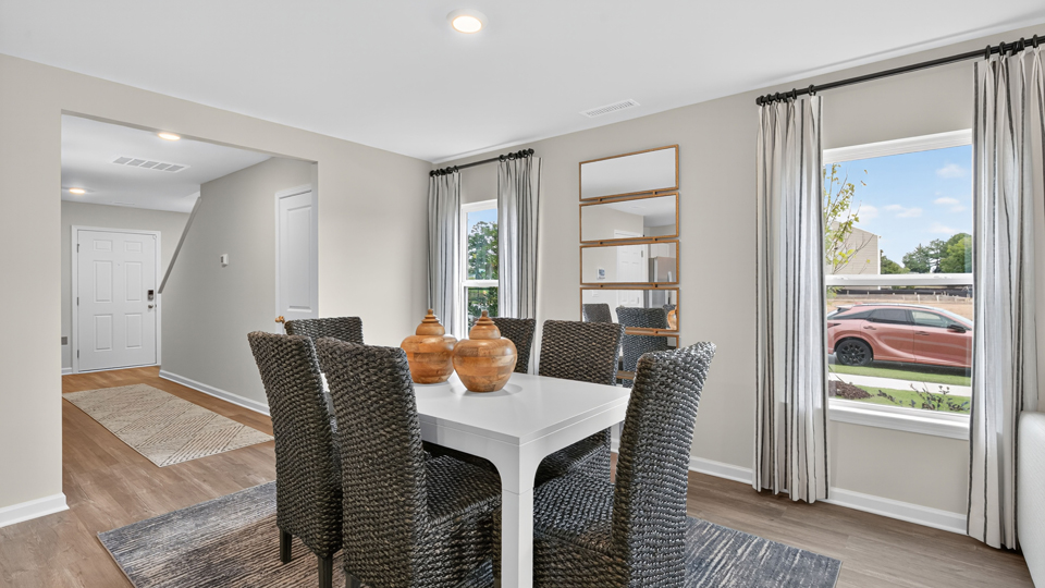 open concept dining space with sliding glass door to patio