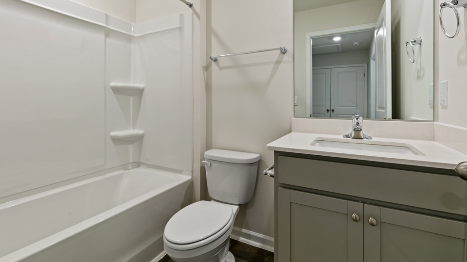 bathroom with quartz countertops