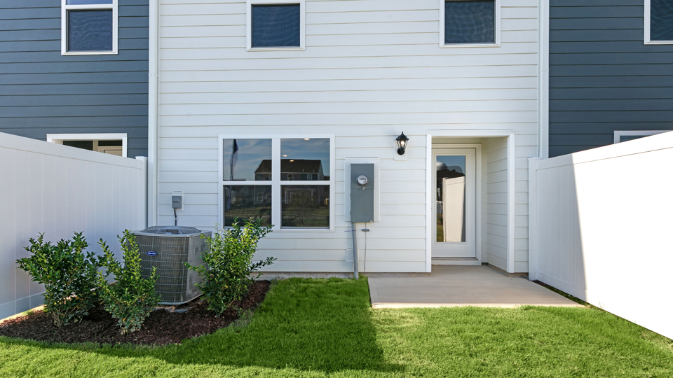 exterior patio with concrete slab and open yard