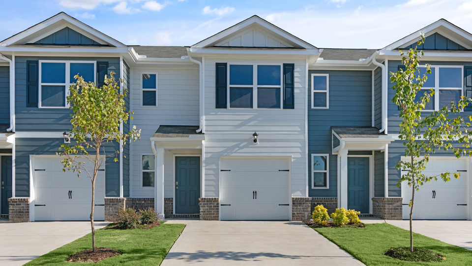 front exterior of pearson a2 with one car garage, white siding, dark blue accents