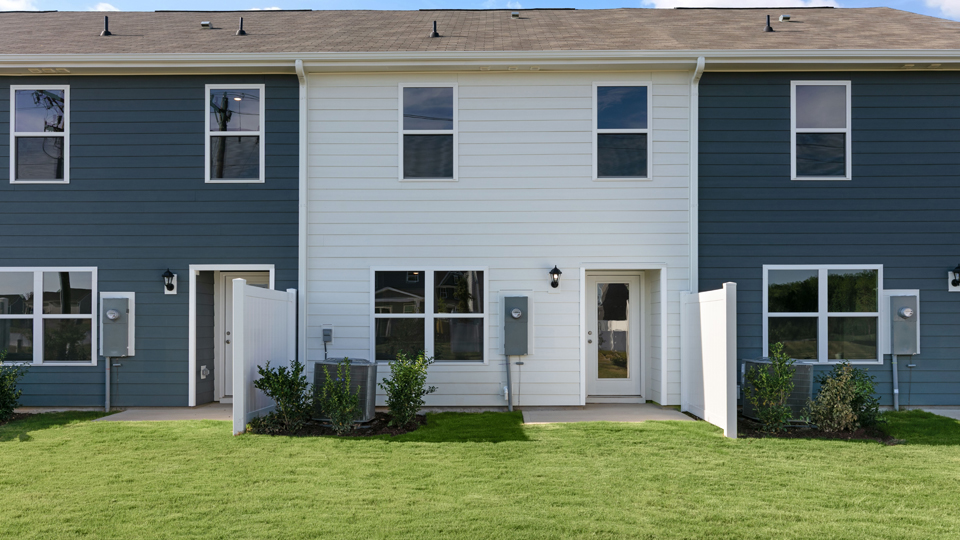 back exterior of pearson a2 floorplan with open yard and concrete patio, no cover