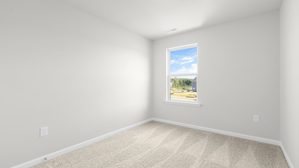 additional bedroom with window, carpeting, closet