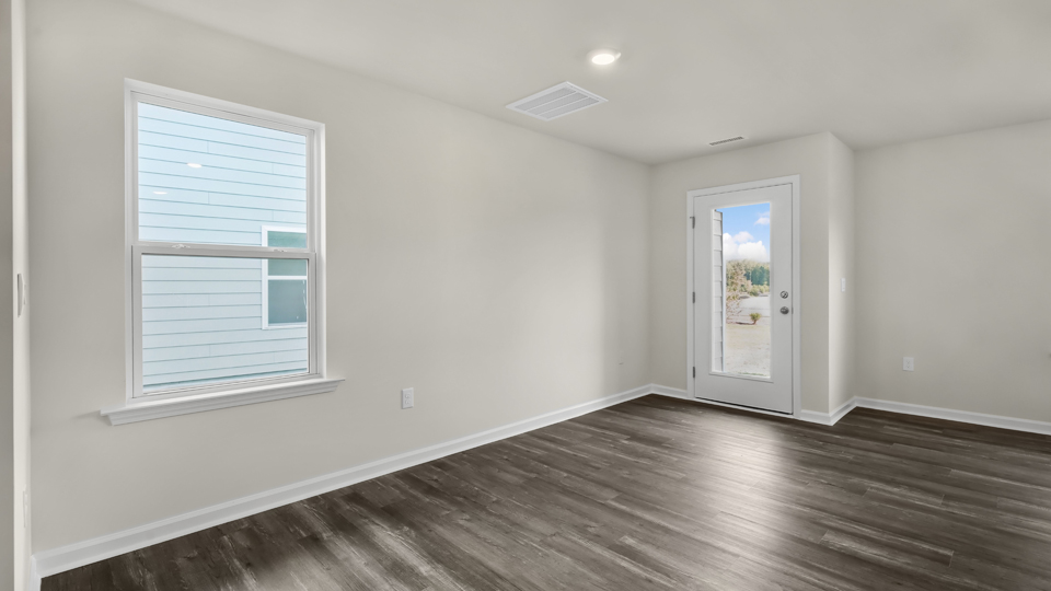 open concept living space with large windows