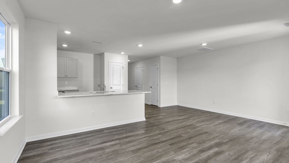 open concept living space with large windows