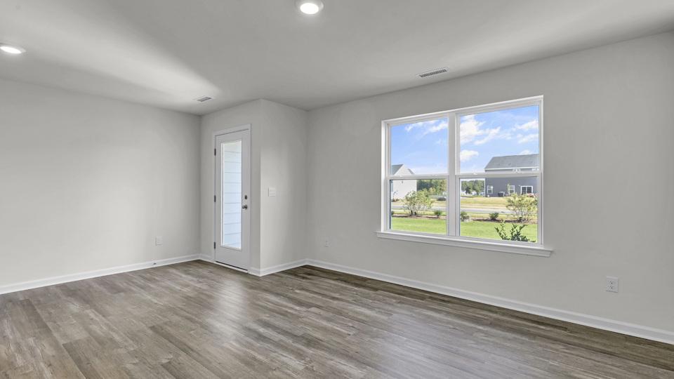 open concept living space with large windows