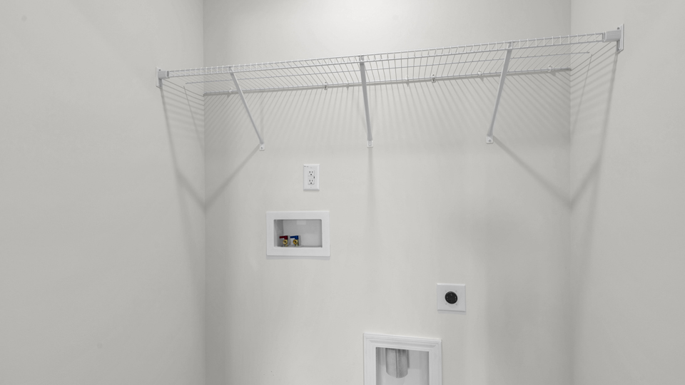 laundry room with wire shelving