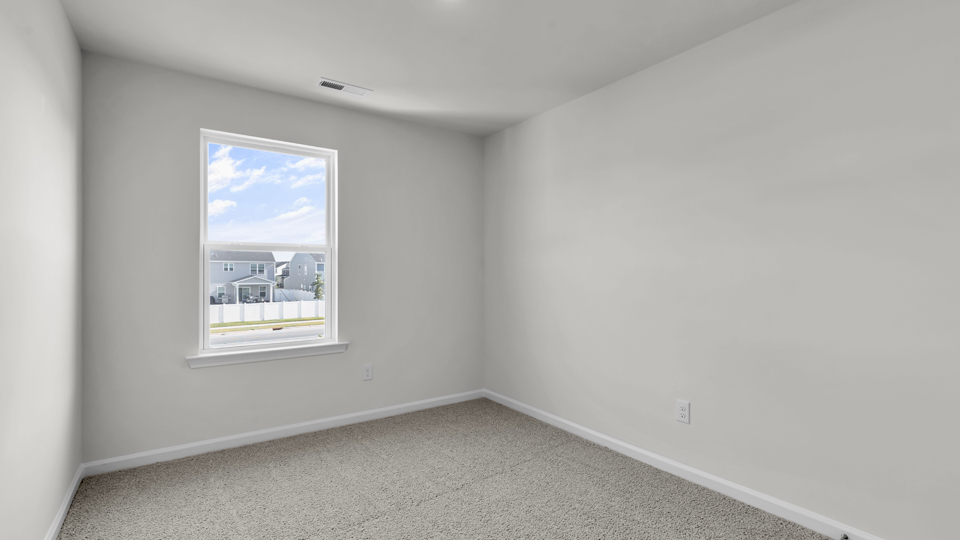 additional bedroom with window, carpeting, closet