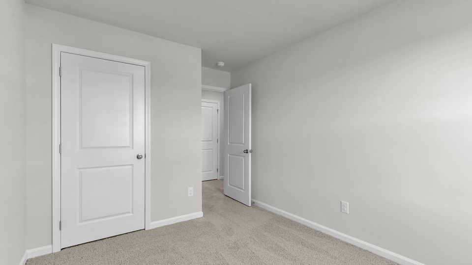 additional bedroom with window, carpeting, closet