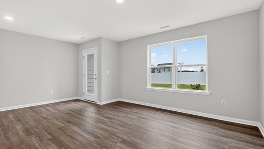 open concept living space with large windows