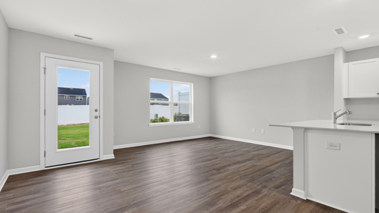 open concept living space with large windows