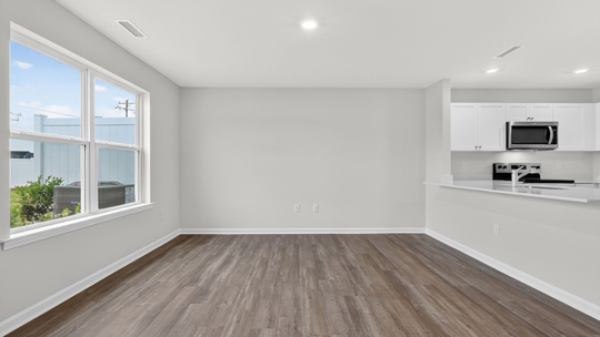 open concept living space with large windows