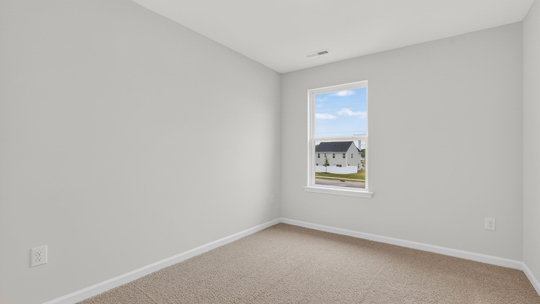 additional bedroom with window, carpeting, closet