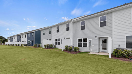 back exterior of Pearson A3 with gray siding and one-car garage
