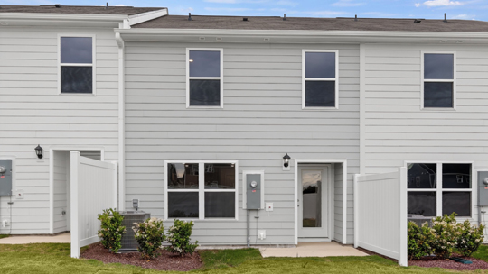 back exterior of Pearson A3 with gray siding and one-car garage