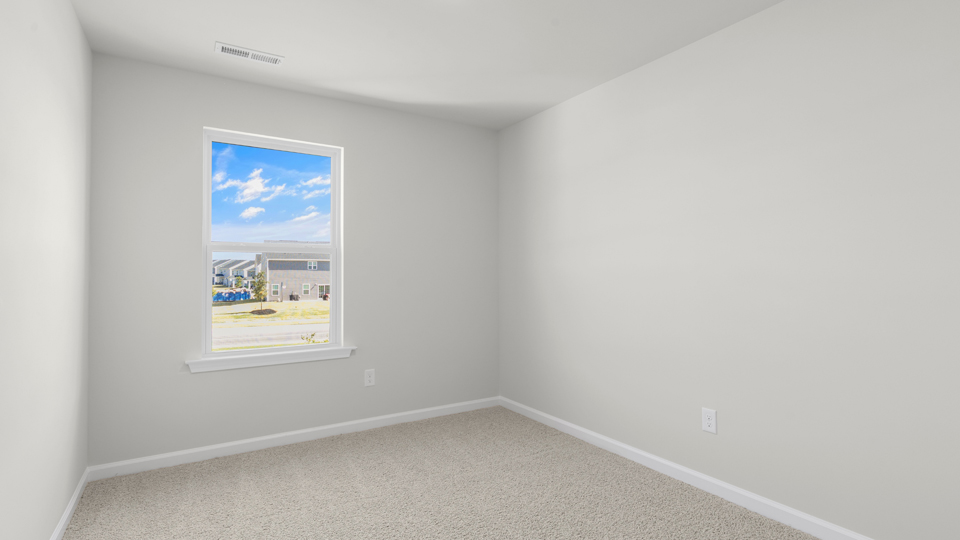 additional bedroom with window, carpeting, closet