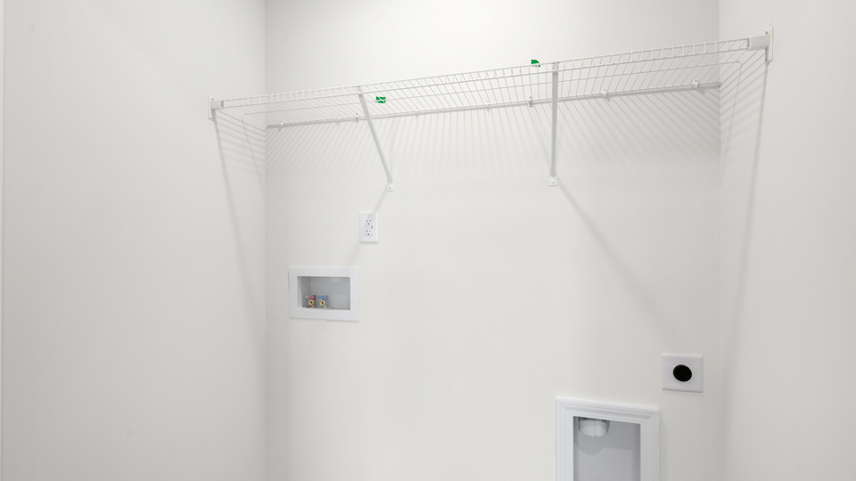 laundry room with wire shelving